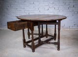 Early 18th Century English Oak Gate Leg Table With Central Drawer. - Harrington Antiques