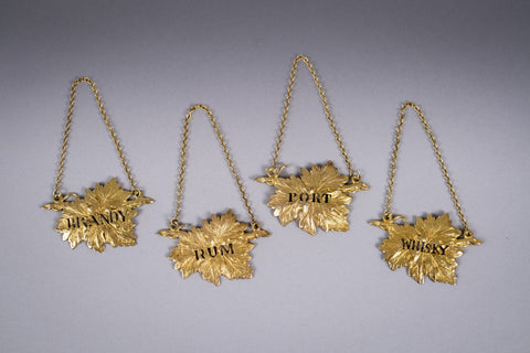 Four Silver Gilt Vine Leaf Decanter Labels by SMD, London, 1968. - Harrington Antiques