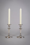 Pair Of Sterling Silver Neoclassical Candlesticks by Charles Boyton & Sons, 1911. - Harrington Antiques