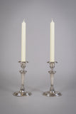 Pair Of Sterling Silver Neoclassical Candlesticks by Charles Boyton & Sons, 1911. - Harrington Antiques