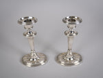 Pair Of Sterling Silver Neoclassical Candlesticks by Charles Boyton & Sons, 1911. - Harrington Antiques