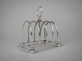 Sterling Silver Five Bar Toast Rack by William Hutton & Sons, Sheffield, 1907. - Harrington Antiques