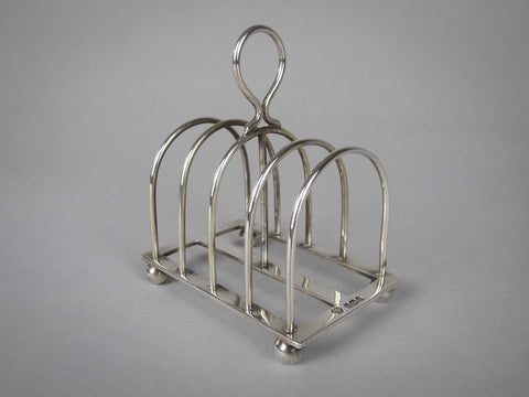 Sterling Silver Five Bar Toast Rack by William Hutton & Sons, Sheffield, 1907. - Harrington Antiques