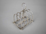 Sterling Silver Five Bar Toast Rack by William Hutton & Sons, Sheffield, 1907. - Harrington Antiques