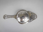 Sterling Silver Tea Strainer by Angora Silver Plate Co, Birmingham, 1932. - Harrington Antiques