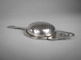 Sterling Silver Tea Strainer by Angora Silver Plate Co, Birmingham, 1932. - Harrington Antiques