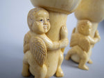 Unusual Pair of 19th Century Carved Bone Cherub Candle Holders. - Harrington Antiques