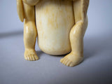 Unusual Pair of 19th Century Carved Bone Cherub Candle Holders. - Harrington Antiques