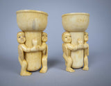 Unusual Pair of 19th Century Carved Bone Cherub Candle Holders. - Harrington Antiques